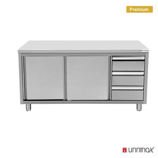 RVS werktafel met schuifdeuren en ladeblok, 600 mm diep Unninox